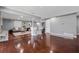 Open living room with hardwood floors, bar seating, a modern fireplace, and recessed lighting at 4166 Idlevale Dr, Tucker, GA 30084