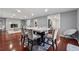 Open concept living and dining area featuring a marble fireplace, hardwood floors, and modern furnishings at 4166 Idlevale Dr, Tucker, GA 30084
