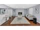Spacious living room featuring hardwood floors, a fireplace and a comfortable seating area at 4166 Idlevale Dr, Tucker, GA 30084
