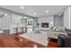 Comfortable living room featuring a modern fireplace, hardwood floors, bar seating and recessed lighting at 4166 Idlevale Dr, Tucker, GA 30084
