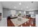 Comfortable living room featuring a modern fireplace, hardwood floors, bar seating and recessed lighting at 4166 Idlevale Dr, Tucker, GA 30084