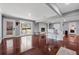 Spacious living room featuring hardwood floors, bar seating, and sliding glass doors at 4166 Idlevale Dr, Tucker, GA 30084
