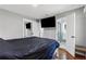 Main bedroom with a wall-mounted television and ensuite bathroom at 4166 Idlevale Dr, Tucker, GA 30084