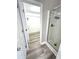 Bathroom showcasing a glass-enclosed shower, updated fixtures, and a walk-in closet at 6945 Autumn Hills Dr, Cumming, GA 30028