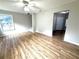 Bright and airy living room featuring hardwood floors, neutral paint, and natural light at 6945 Autumn Hills Dr, Cumming, GA 30028