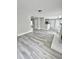 Bright and open living space with durable floors, neutral paint, and seamless flow to other rooms at 6945 Autumn Hills Dr, Cumming, GA 30028
