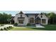 Beautiful new construction home featuring a paved driveway, landscaping, and attractive gray exterior at 2468 Rockbridge Nw Rd, Conyers, GA 30012