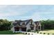 Charming home exterior with a dark roof, gray siding, manicured lawn and professionally landscaped front yard at 2468 Rockbridge Nw Rd, Conyers, GA 30012
