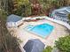 Aerial view of community pool featuring seating, pool house, and fenced perimeter at 2748 Suwanee Se Way, Marietta, GA 30067