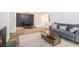 Stylish living room with modern decor, an electric fireplace, and an adjacent dining area at 2748 Suwanee Se Way, Marietta, GA 30067