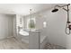This bathroom features a stylish soaking tub and glass enclosed shower with stone flooring at 3524 Old Towne Ln, Cumming, GA 30040