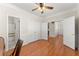 Versatile bedroom with natural light, hardwood floors, and ample closet space at 3524 Old Towne Ln, Cumming, GA 30040