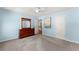 Spacious bedroom featuring carpet flooring, a classic dresser, and tasteful decor for a welcoming retreat at 3524 Old Towne Ln, Cumming, GA 30040
