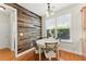 Charming breakfast nook has wood wall, window and door and is conveniently located off the kitchen at 3524 Old Towne Ln, Cumming, GA 30040