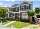 Inviting two-story home featuring lush landscaping and charming curb appeal at 3524 Old Towne Ln, Cumming, GA 30040