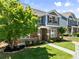 Beautiful two-story home with manicured lawn and lush landscaping at 3524 Old Towne Ln, Cumming, GA 30040