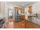Kitchen featuring granite counters, stainless appliances and view to breakfast area with backyard view at 3524 Old Towne Ln, Cumming, GA 30040