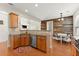 Kitchen boasts stainless steel appliances, wooden cabinets, and a charming eat-in breakfast nook at 3524 Old Towne Ln, Cumming, GA 30040