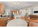 Kitchen boasts stainless appliances, granite countertops, and opens to a comfortable living space at 3524 Old Towne Ln, Cumming, GA 30040