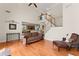 Open floor plan showcasing the living room's soaring ceilings, hardwood floors and staircase at 3524 Old Towne Ln, Cumming, GA 30040