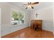 Bright office with large window, hardwood floors, and classic roll-top desk at 3524 Old Towne Ln, Cumming, GA 30040