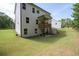 Backyard with a lush lawn, patio, and deck under a home's traditional design at 63 Brookstone E Park, Acworth, GA 30101
