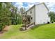 This home has a deck, stairs leading down to the walkout basement, and a spacious grassy yard at 63 Brookstone E Park, Acworth, GA 30101