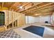 Spacious unfinished basement with exposed ceiling, stud walls, and staircase at 63 Brookstone E Park, Acworth, GA 30101