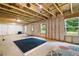 Spacious unfinished basement with exposed ceiling, insulated walls, and large windows at 63 Brookstone E Park, Acworth, GA 30101