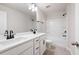 This bathroom features a double sink vanity, large mirror, tile floors, and bathtub with shower at 63 Brookstone E Park, Acworth, GA 30101