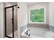 Bathroom boasts a separate shower and soaking tub with a view of the outdoors at 63 Brookstone E Park, Acworth, GA 30101