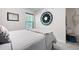 Bright bedroom with a decorative mirror and design, and natural light from window at 63 Brookstone E Park, Acworth, GA 30101
