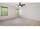 Bright bedroom with neutral carpet and two large windows at 63 Brookstone E Park, Acworth, GA 30101