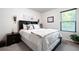 Comfortable bedroom with a decorative headboard and natural light at 63 Brookstone E Park, Acworth, GA 30101