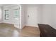 Bright entryway with hardwood floors, featuring a white front door and a glass-paned interior door at 63 Brookstone E Park, Acworth, GA 30101