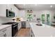 Modern kitchen featuring an island with quartz countertops at 63 Brookstone E Park, Acworth, GA 30101