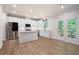 Bright, open kitchen featuring white cabinets, stainless appliances, and an island with Quartz countertops at 63 Brookstone E Park, Acworth, GA 30101