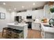 Modern kitchen with a breakfast bar island and stainless steel appliances at 63 Brookstone E Park, Acworth, GA 30101
