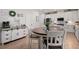 Open concept kitchen with white cabinetry and a cozy breakfast table at 63 Brookstone E Park, Acworth, GA 30101