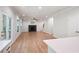 Bright living room featuring hardwood floors, modern fireplace, and access to outdoor balcony at 63 Brookstone E Park, Acworth, GA 30101