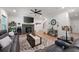 Spacious living room with a fireplace, staircase, hardwood floors, and an open layout at 63 Brookstone E Park, Acworth, GA 30101