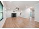 Spacious living room with hardwood floors, fireplace, and staircase leading to the upper level at 63 Brookstone E Park, Acworth, GA 30101
