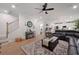 Open concept living room featuring hardwood floors, a staircase, and seamless flow into the kitchen at 63 Brookstone E Park, Acworth, GA 30101