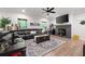 Cozy living room with a fireplace, large TV, comfortable seating, and stylish decor at 63 Brookstone E Park, Acworth, GA 30101