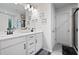 Elegant main bathroom with double sinks, white cabinets and grey tiling in the shower at 63 Brookstone E Park, Acworth, GA 30101