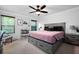 The main bedroom features a large bed, window, ceiling fan and two bedside tables at 63 Brookstone E Park, Acworth, GA 30101