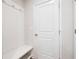 Mud room featuring a built-in bench, coat hooks, and a storage cubby with an open door at 63 Brookstone E Park, Acworth, GA 30101