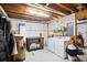 Unfinished basement with a washer, dryer, table and exposed ceiling at 1491 Kolb Ridge Sw Dr, Marietta, GA 30008