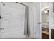 Clean bathroom features a shower and tub combination with a modern shower curtain at 1491 Kolb Ridge Sw Dr, Marietta, GA 30008