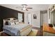 Comfortable bedroom featuring hardwood floors, soft lighting, and a calming color palette at 1491 Kolb Ridge Sw Dr, Marietta, GA 30008
